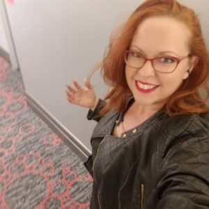 Nikki Ivana, the Las Vegas Masseuse, wearing a black leather jacket